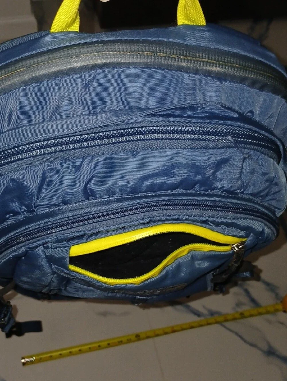 The North Face Navy Blue Backpack with Yellow Accents